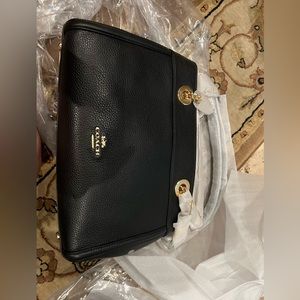 Coach new with tags purse, gold chain and leather handles. 3 pockets,